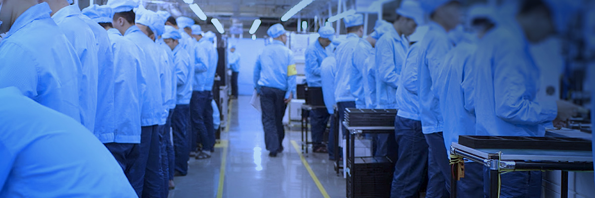 Factory workers in an assembly line